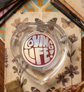 THE "LOVING LIFE!" HEART-SHAPED GLASS ASHTRAY